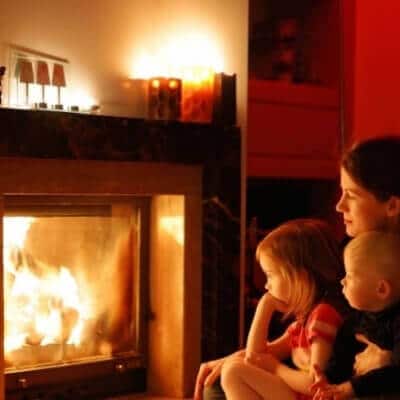 Family Infront Of Fireplace